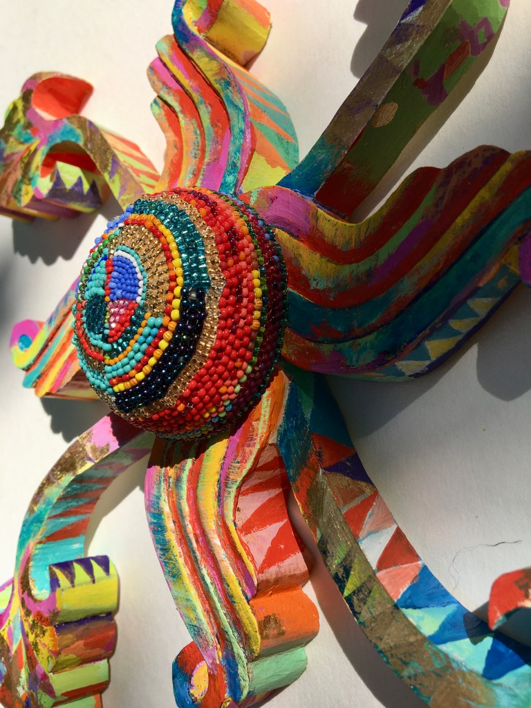 Painted beaded woodcarving by Lynne McIlvride